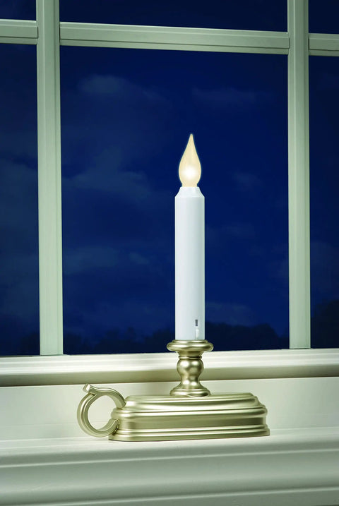Battery Operated LED Window Candle With Dusk To Dawn Sensor And Hot Spot Flame Technology In Amber Or White Finish on windowsill