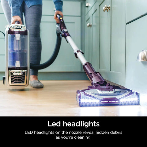 Shark Rotator Powered Lift Away TruePet Upright Vacuum With Hepa Filter large dust cup capacity and LED headlights in use.