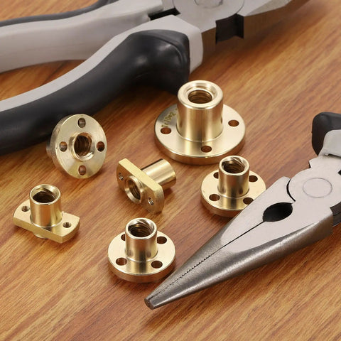 8 Pcs TR8x8 Brass Lead Screw Nut Set With Trapezoidal Acme Thread 2mm Pitch 4 Start 8mm Lead with tools on table.