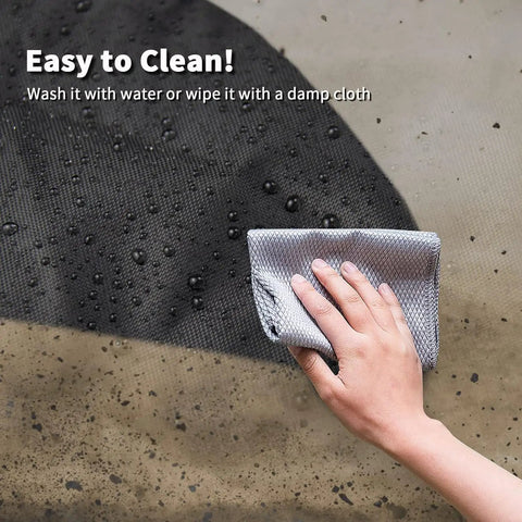 Close-up of cleaning waterproof Boss Level Heavy Duty Table Saw Cover for Bosch 10 Inch Saws With Wheeled Stand.