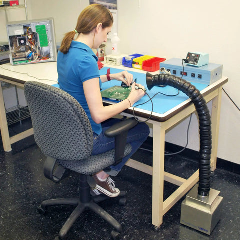 Woman using Portable Solder Fume Extractor With Pro Grade Lightweight Build ESD Safe Base Tool Free Filter Change