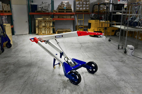 Powered Hand Truck Lift System With Hook, 309 Lb Lift Capacity in a warehouse setting