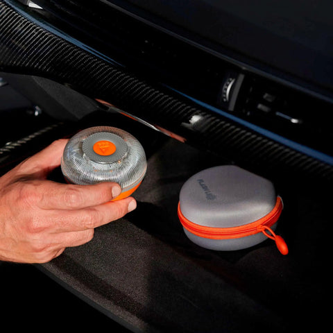 Hand holding V16 Approved Led Emergency Warning Beacon Offering Knockout Night Visibility With Rock Solid Magnetic Base.