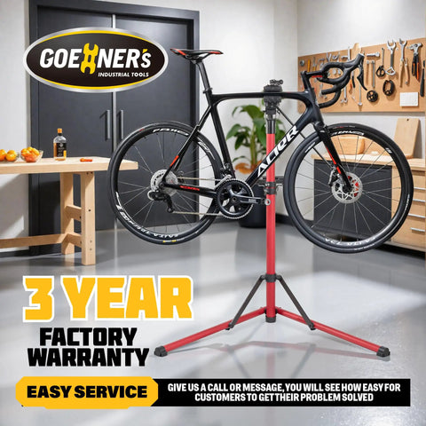 Beefed Up 2.0 Bike Repair Stand Portable Aluminum Workstand with a road bike mounted in a garage setting