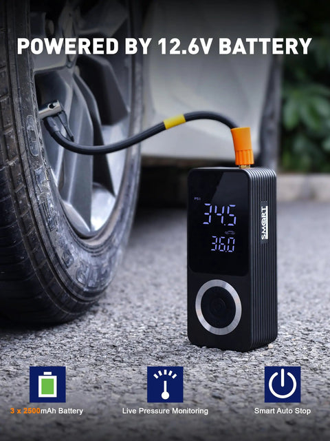 Cordless Tire Inflator With Gauge On The Go Mini Air Compressor next to car tire, powered by built-in 12.6V battery.
