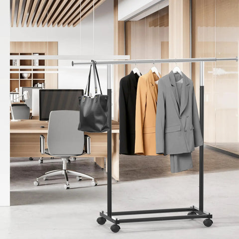 Heavy Duty Steel Clothing Rack With Extensible Top Rod And Chrome Accents In Slick Black Paint Built Solid For Dorm Life And Cramped Closets Easy Setup Rack To Hang All Your Threads Stress Free with blazers and handbag in office setting