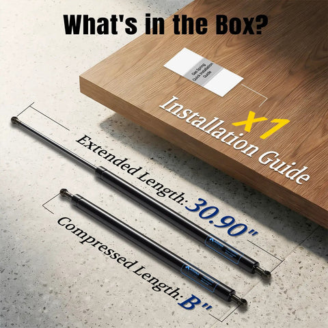 Heavy Duty Gas Struts For Tru with 30.90' extended length and compressed length, shown with installation guide on wood.