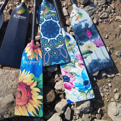 Colorful dragon boat paddles with floral designs, fiberglass, arranged outdoors, focus on decorative patterns and branding.