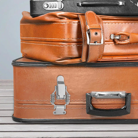 Heavy Duty Iron Toggle Latches With Double Spring Design For Rv Cabinets, Toolboxes And Industrial Storage on orange suitcase.