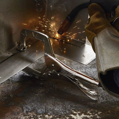 11 Inch Locking C Clamp With Swivel Pads Heavy Duty USA Made Steel Clamping Tool in use during welding, sparks visible