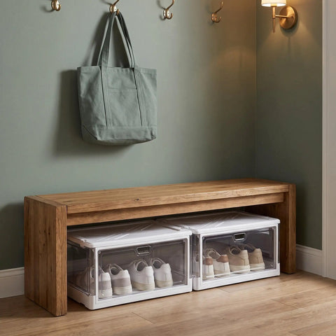 Clear Stackable Storage Bins With Transparent Slide Front Doors organizing shoes under a wooden bench in a room.