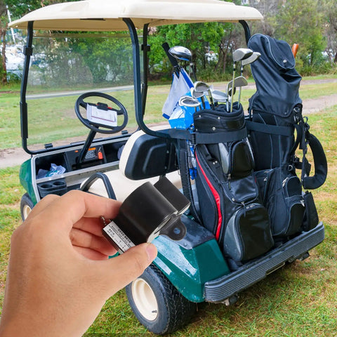 Hand holding Inductive Throttle Sensor Assembly For Golf Carts in front of a golf cart with clubs, outdoor setting.