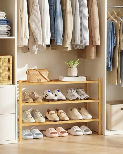 Solid Three Tier Bamboo Shoe Rack For Front Door Entryway with various shoes stored, 26.8" x 11" x 18.9" size, natural bamboo material.