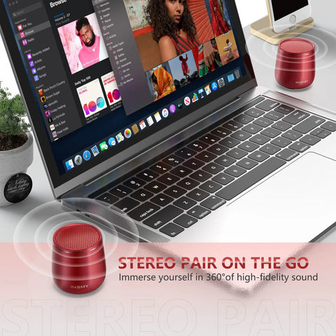 Compact Waterproof Bluetooth Speaker With Big Sound next to a laptop, red mini wireless speaker for travel, stereo pairing shown