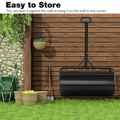 Tow Behind Lawn Roller With 30 Gallon Water Sand Fill For Tractor Push And Pull, stored upright, showing easy storage against a wall