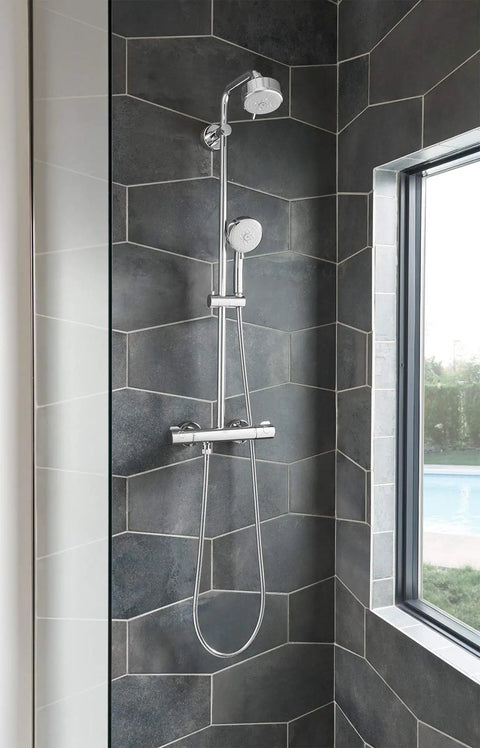 Tempesta Cosmopolitan 2.5 GPM 4-Spray Hand Shower In Starlight Chrome installed in modern bathroom.