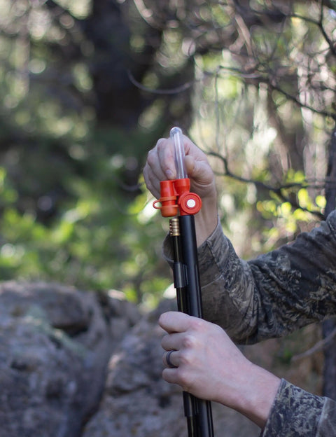 Pocket Ready Muzzleloader Quick Loader Kit with BH209 Tubes in use outdoors, compact low profile orange accessory