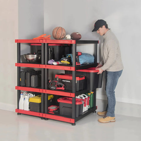 Heavy Duty Four Tier Plastic Storage Shelves For Garage Organization Built Tough With Ample Space Easy Setup Indoors Or Out, man placing a bin on the shelf.