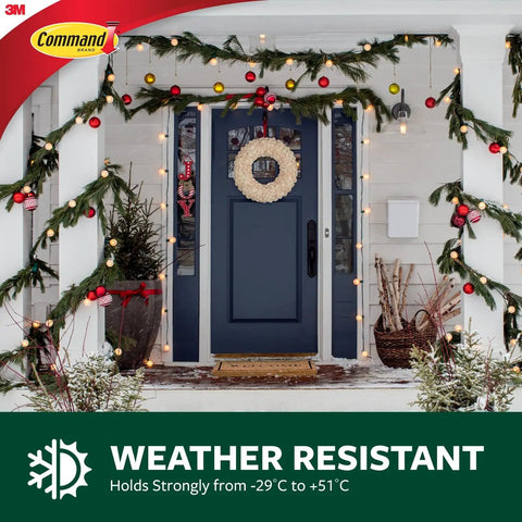Invisible Mini Decorating Hooks With Strong Adhesive Strips Pack Of Twenty For Fairy Lights And Wall Art Tool Free Installation No Sweat Setup Quick Clean Removal No Drama Hanging displayed with Christmas decor on a front door.