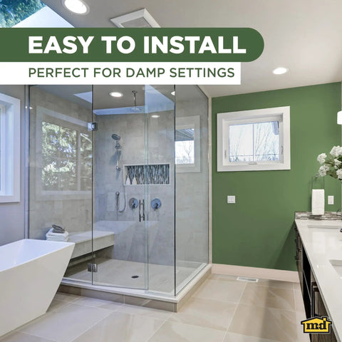 Modern bathroom with glass shower, promoting easy install of 4 Inch By 120 Foot Dry Back Vinyl Wall Base With Toe Kick in beige.