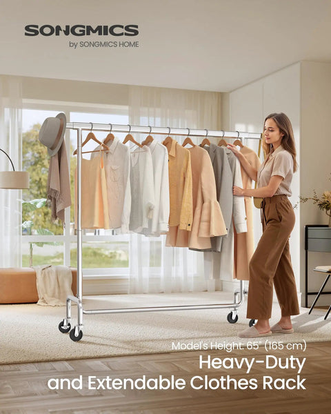 Heavy Duty Rolling Clothes Rack With Extendable Hanging Rod And Hella Sturdy Steel Frame Built Tough To Handle Maximum Load Smooth Glide Casters in a modern room with clothes organized.