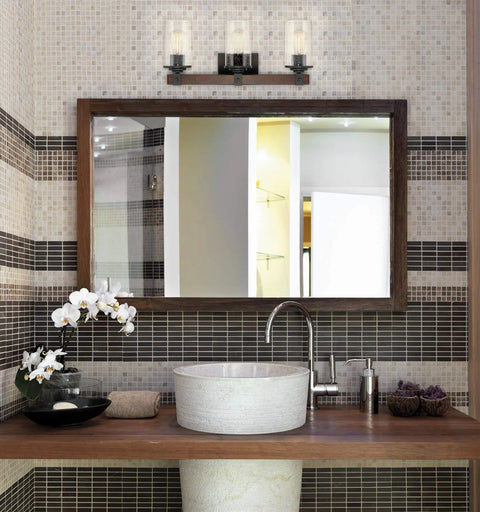 3-Light Farmhouse Vanity Light, 23 Inches, Black Textured Finish With Seeded Glass Shades And Walnut Wood Bar in bathroom setting