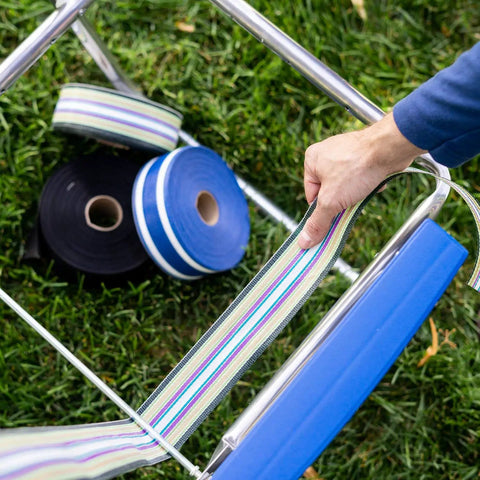 Revamp Your Worn Out Lawn Chairs With This Heavy Duty Replacement Webbing Kit Featuring UV Resistant Polypropylene Straps laid out beside a chair.