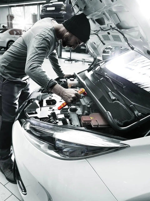 Technician using Insulated Zyklop VDE Ratchet With Switch Lever Three Eighths Inch Drive 80-Tooth Fine-Tooth Gear under car hood