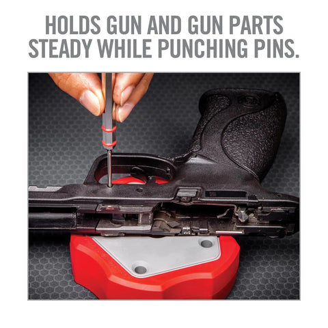 Non Marring Universal Armorers Bench Block With Non Slip Grip Ideal For Glock 17 19x 26 1911 And Other Firearms A Versatile Gunsmithing Essential For Safe Secure Maintenance And Precision Work used while punching pins from a pistol firearm on a gunsmithing bench.