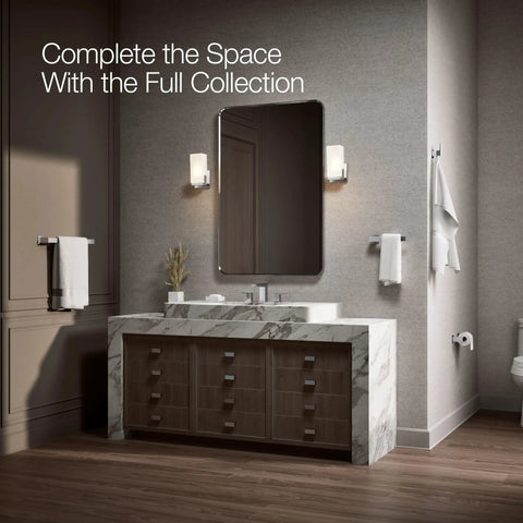 Modern bathroom with marble vanity, mirror, wall lights, featuring the Honesty 18 Inch Towel Bar Polished Chrome For Modern Bathrooms.