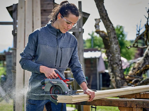 Professional Brushless Cordless Circular Saw Featuring 165MM Blade And Turbo Motor For Clean Wood Cutting And Heavy Duty Framing With Zero Bs Maintenance And Extended Runtime Built Tough For Serious Job Site Work, cutting wood with precision outdoors.