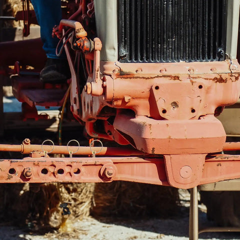Close-up of tractor hitch with installed Heavy Duty Zinc Plated Spring Loaded Lynch Pin Kit 10pcs 8x45mm With Ring