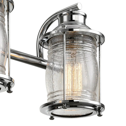 Close-up of a chrome fixture with ribbed seeded glass shade for Three Light Vanity Light In Chrome With Ribbed Seeded Glass Shades For A Coastal Bathroom Vibe, Modern Chrome Finish, Bulb Not Included, Premium 3 Light Bath Fixture For Sleek Easy Lighting Upgrade.