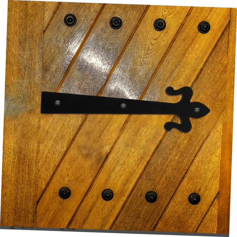 Heavy duty iron cabinet hinges on wooden door showcasing durability and design