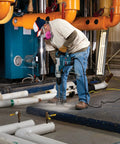 Worker using 3 9/16 Inch Rotary Hammer Core Bit Set with Wave Design for drilling in industrial setting