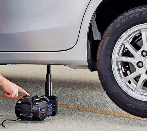 Heavy Duty Electric Floor Jack And Quick Fill Tire Inflator Pump Combo For Fast Flat Fixes 2 In 1 under a car lifting it with a tire inflator.