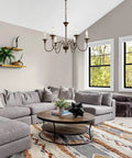 Living room view with Six Light Farmhouse Chandelier in Oil Rubbed Brown and White Finish, enhancing rustic chic décor.