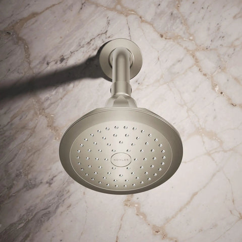 5-1/2 Inch 1-Function Showerhead With Nickel Finish, 2.5 GPM, Air-Induction Technology, installed against marble wall