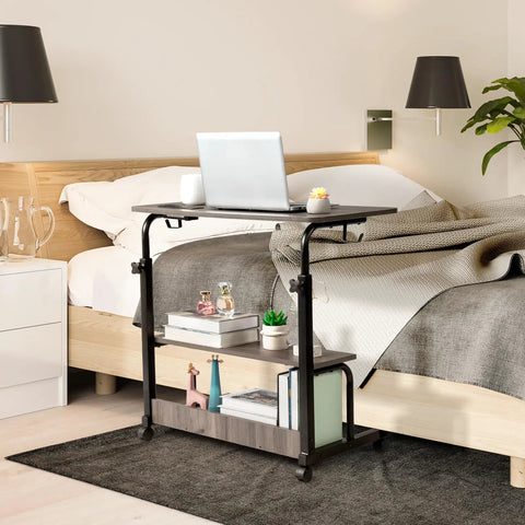 Hella Sturdy Adjustable Standing Desk On Smooth Lockable Wheels, Super Slick Rolling Laptop Station With Storage Shelves, Easy Setup Grey Oak Home Office Daily Driver by bed with laptop.