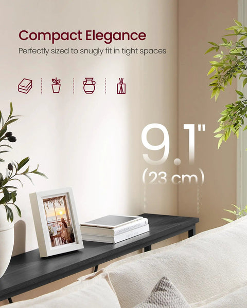 Slim Entryway Console Table With Industrial Chic Matte Black Steel Pipes, shown behind a sofa with decor items, 9.1 in depth.