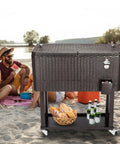 Portable Patio Cooler Bar Cart 80QT Rolling Beverage Station With Storage Shelf Lockable Wheels And Bottle Opener on beach
