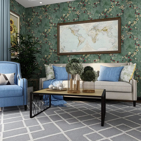 Living room with floral peel and stick wallpaper, apricot flowers on green background, decorative wall covering on accent wall