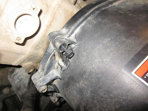 Close-up of a clutch cover bolt on an ATV, showcasing Six Pack Clutch Cover Screw Bolt Set Oem 7512094 Atv Utv Sportsman Rzr Ranger.