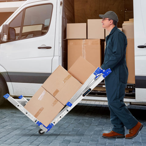Man using dolly with packages near van