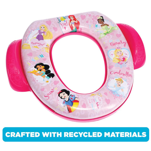 Toddler Potty Seat Featuring Disney Princess Loving Life Print With Lowkey Plush Cushion And Secure Grip Handles Training Aid Snugs Right Onto Standard Or Elongated Toilets Quick Wipe Down Setup Built Dang Solid Made In Usa on a pink background with princess graphics.