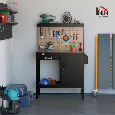 Boss Level Multipurpose Workbench With Lockable Storage Cabinet And Slide Drawer in garage setting with tools on pegboard