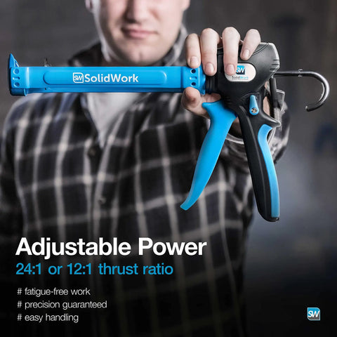 Man holding Premium Hand Caulk Gun With 24 To 1 Adjustable Thrust Ratio Dripless Caulking Tool, blue handle, close-up view.