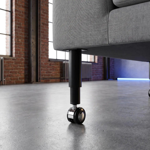 Close-up of Beefy Adjustable Furniture Legs With Caster 2 Pack For Desk And Office Tables Replacement Feet Leveling Support attached to sofa