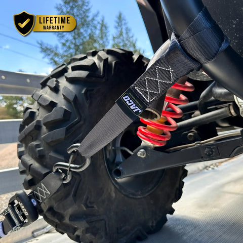 Heavy Duty Ratchet Straps With Soft Loops 1.6 Inches By 8 Feet Pack Of Four For Motorcycles ATVs And Trailers 5208 Lbs Break Strength securing an ATV tire.