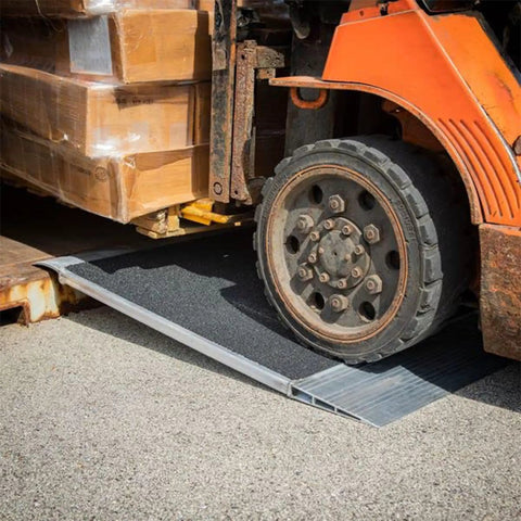 Heavy Duty Aluminum Shipping Container Forklift Ramp 60 By 63 Inch Deck Designed For 12000 Lb Per Axle Loads with forklift in use.